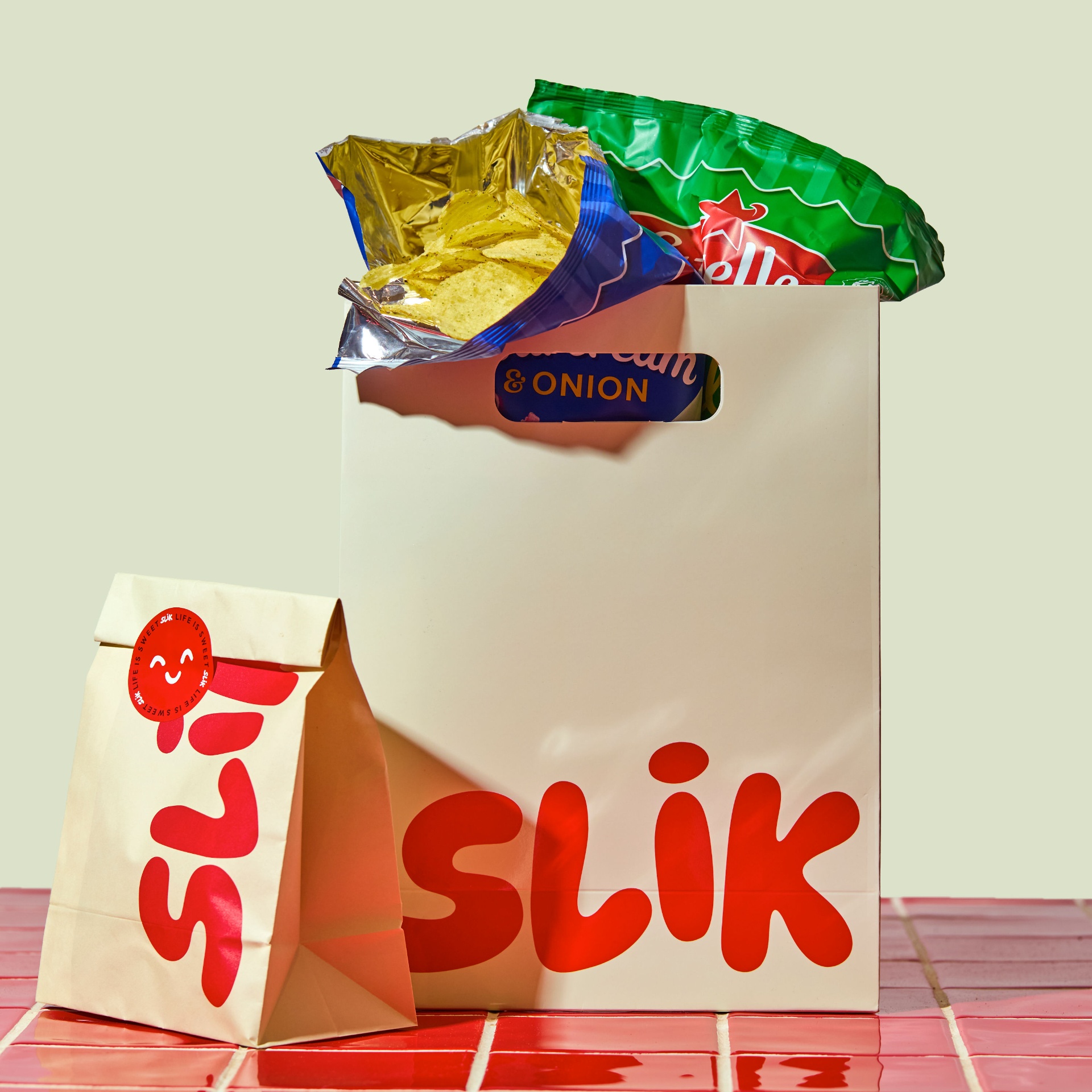 SLIK paper bags filled with chips and snacks
